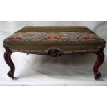 A Victorian rosewood footstool, of large proportions, the stuffover needlework and velour