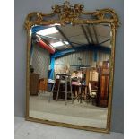 A large gilt and gesso pier mirror with pierced swagged foliate acanthus scroll crested frieze,