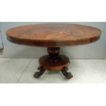 A William IV flame mahogany breakfast table, the large circular top with snap action on octagonal