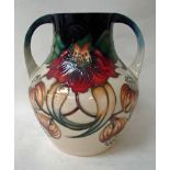 A late 20th century Moorcroft pottery vase of two handled baluster form, by Nicola Slaney,