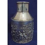 An Edwardian silver tea caddy of small proportions, circular form with tapered shoulder and