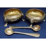 A pair of Victorian silver salts of compressed circular form, reeded rim, three pad feet, internally