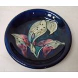 A Walter Moorcroft pottery dish of circular form, tubeline decorated in the Lords and Ladies pattern