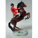 A Beswick pottery model Huntsman on Brown Rearing Horse, number 868, gloss finish, circular stamp to