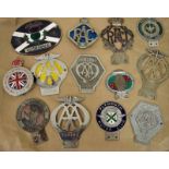 A collection of thirteen vintage car badges early 20th century to 1970's including five AA, two RAC,