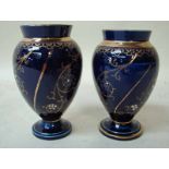 Two Macintyre vases of small proportions, ovoid form with straight neck, on circular spreading foot,