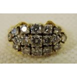 A ladies 18ct gold an diamond cluster ring set with seventeen brilliant cut stones of various