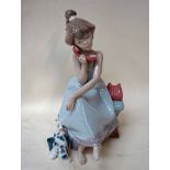 A Lladro porcelain figural group Girl on Telephone with dog, Chit Chat, number 5466 circa 1988, 20.