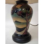 A late 20th century Moorcroft Pottery table lamp of inverted baluster form, tubeline decorated in