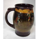 A Royal Doulton stoneware mug of ovoid form, decorated in relief with scenes of gentlemen golfers on