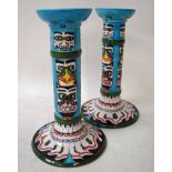 A rare pair of Moorcroft Pottery candlesticks, circa 1999, tube lined in the Tribal Image design