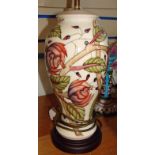 A late 20th century Moorcroft Pottery table lamp of inverted baluster form, tubeline decorated