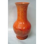 A Pilkingtons Royal Lancastrian vase, baluster shape with flared neck, decorated with an orange