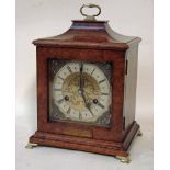 An early to mid 20th century walnut cased bracket clock, pagoda top case with brass carry handle,