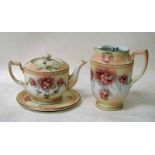 A Wilshaw and Robinson Carlton ware blush ivory teapot and sand, hand painted with flower sprays,