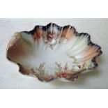 A Wilshaw & Robinson Carlton ware blush ivory fruit bowl of shell form with scroll handle, hand