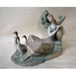 A Lladro porcelain model of a girl resting against a tree trunk with water jug and three geese, on