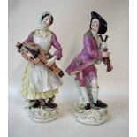 A pair of 19th century continental porcelain figures of peasant musicians, the lady playing a