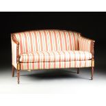 A FEDERAL STYLE STRIPED SILK UPHOLSTERED AND CARVED MAHOGANY SETTEE, BY THE HICKORY CHAIR COMPANY,