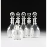 A GROUP OF SIX AMERICAN BLOWN MOLD GLASS DECANTERS, POSSIBLY EARLY 19TH CENTURY, comprising a set of