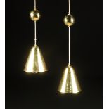 PAAVO TYNELL (Finnish 1890-1973) A PAIR OF HEIGHT ADJUSTABLE PERFORATED BRASS PENDANT FIXTURES,