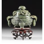 A CHINESE CARVED GREEN JADE TRIPOD CENSER WITH LID, LATE QING DYNASTY, CIRCA 1900, the dark green