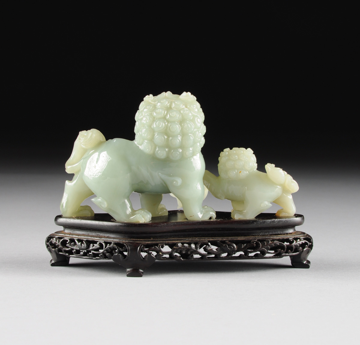 A CHINESE CARVED JADEITE FIGURAL GROUP OF TWO FOO DOGS, 20TH CENTURY, of a large foo dog with a - Image 6 of 8