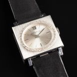A 14K WHITE GOLD AND DIAMOND LADY'S BENRUS 6406 WATCH, serial # 632137, measuring 22 x 25