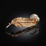 AN 18K YELLOW GOLD FRENCH LADY'S LEAF-FORMED BROOCH, the mounting set with round and baguette