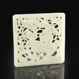 A CHINESE CARVED WHITE JADE RETICULATED PLAQUE, in a Ming Dynasty style and of rectangular form with