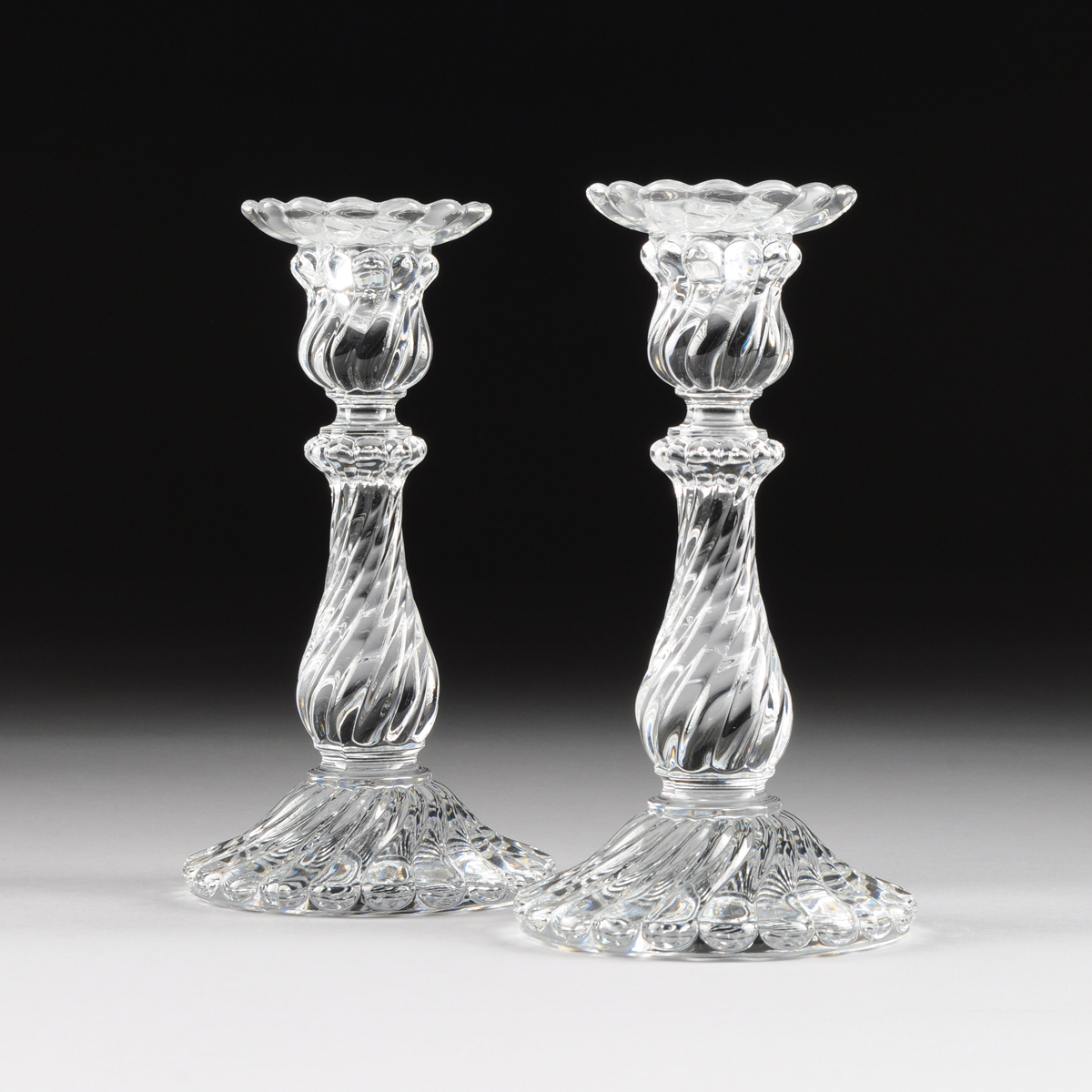 A PAIR OF BACCARAT MOLDED CLEAR CRYSTAL CANDLESTICKS, BACCARAT, FRANCE, MODERN, of baluster form