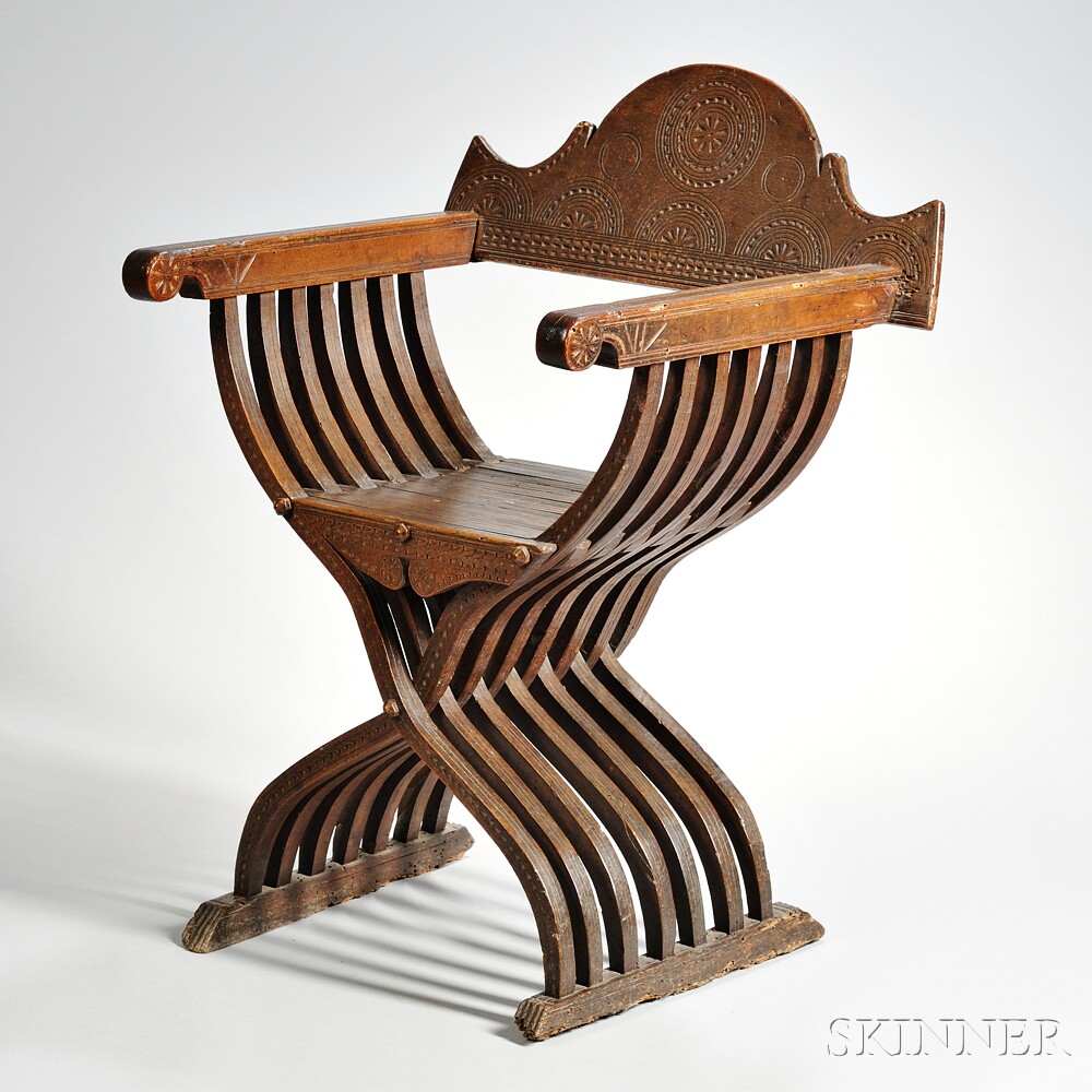 Italian Walnut Folding Savonarola Chair, with carved sunburst decoration to the folding back,