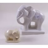 An Art Deco white pottery elephant and a smaller elephant