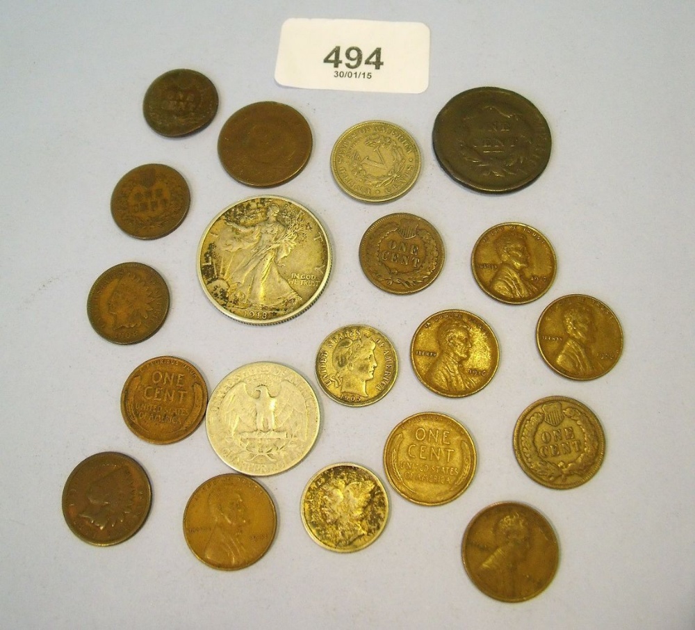 A tray of USA coins including six Indian head cents 1875 (bent) 1893, 1899, 1902, 1905 and 1908,