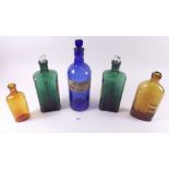 Five old coloured glass medicine bottles
