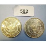 Two silver Morgan dollars both 7 tail feathers, (a) 1885 New Orleans Mint - Condition: VF (b) 1886 -