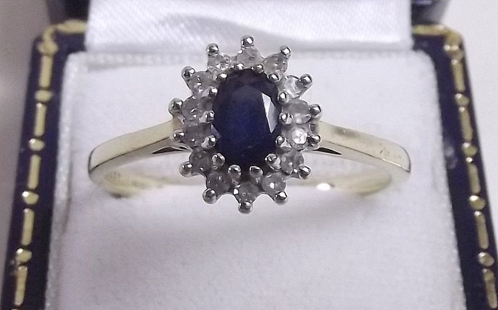 A 9 carat gold sapphire and diamond ring