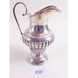 A silver half reeded cream jug - Birmingham 1911 - 2.5 ozs