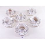 A set of six coffee cups and saucers decorated blue sprigged floral decoration