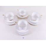 A Royal Albert white and gilt teaset comprising ten cups and saucers and eleven tea plates