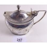 A Georgian silver oval mustard pot with engraved decoration and hinged lid, missing liner - London