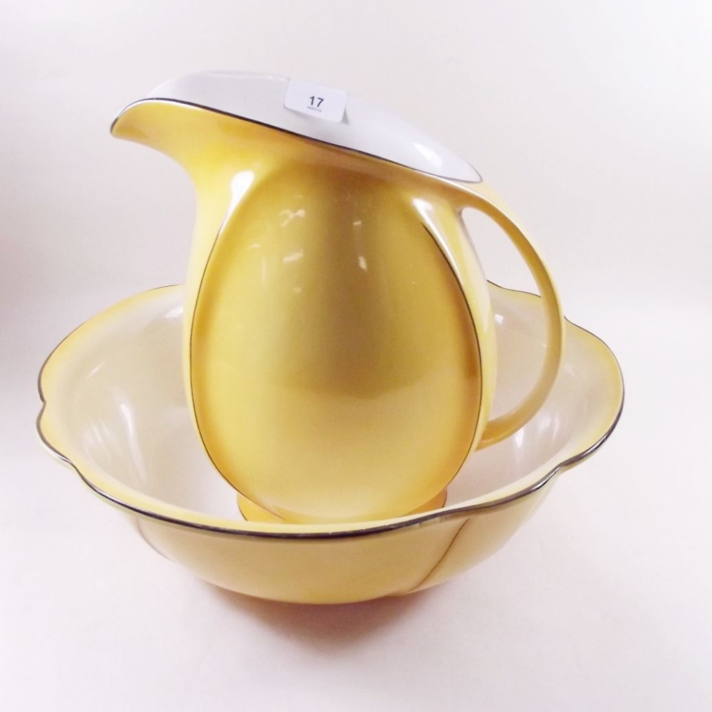 An Art Deco yellow toiletry jug and bowl set