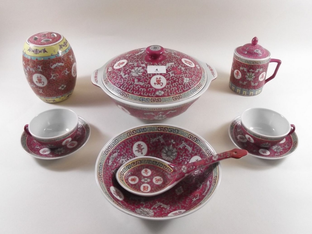 A Chinese red tureen, bowl, jar, two meat plates and set of eight cups and saucers etc