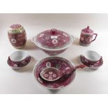 A Chinese red tureen, bowl, jar, two meat plates and set of eight cups and saucers etc