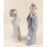 Two Nao figures - boy kissing and a nun