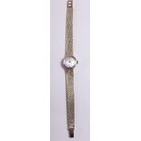 A 9 carat gold Omega ladies wrist watch and gold strap