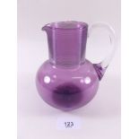 A Victorian amethyst glass jug