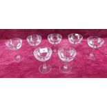 Seven cut glass champagne glasses