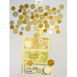A tray of world coins and banknotes 20th century countries including: Bahamas, Barbados, East