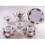 A Royal Albert teaset comprising teapot, two jugs, two sugars, eight cups and saucers, twelve tea